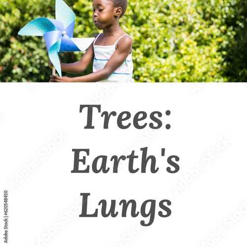 Composition of trees earth's lungs text over african american girl with toy windmill