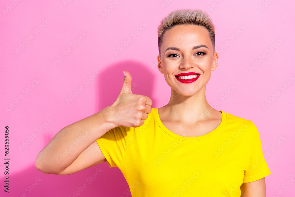 Portrait of lovely gorgeous positive person beaming smile hand finger demonstrate thumb up isolated on pink color background Portrait of lovely gorgeous positive person beaming smile hand finger demonstrate thumb up isolated on pink color background