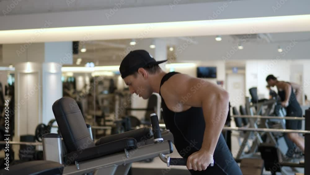 Young Male Doing Dips For Tricep Chest Muscule Training In Gym - profile view slow motion Young Male Doing Dips For Tricep Chest Muscule Training In Gym - profile view slow motion
