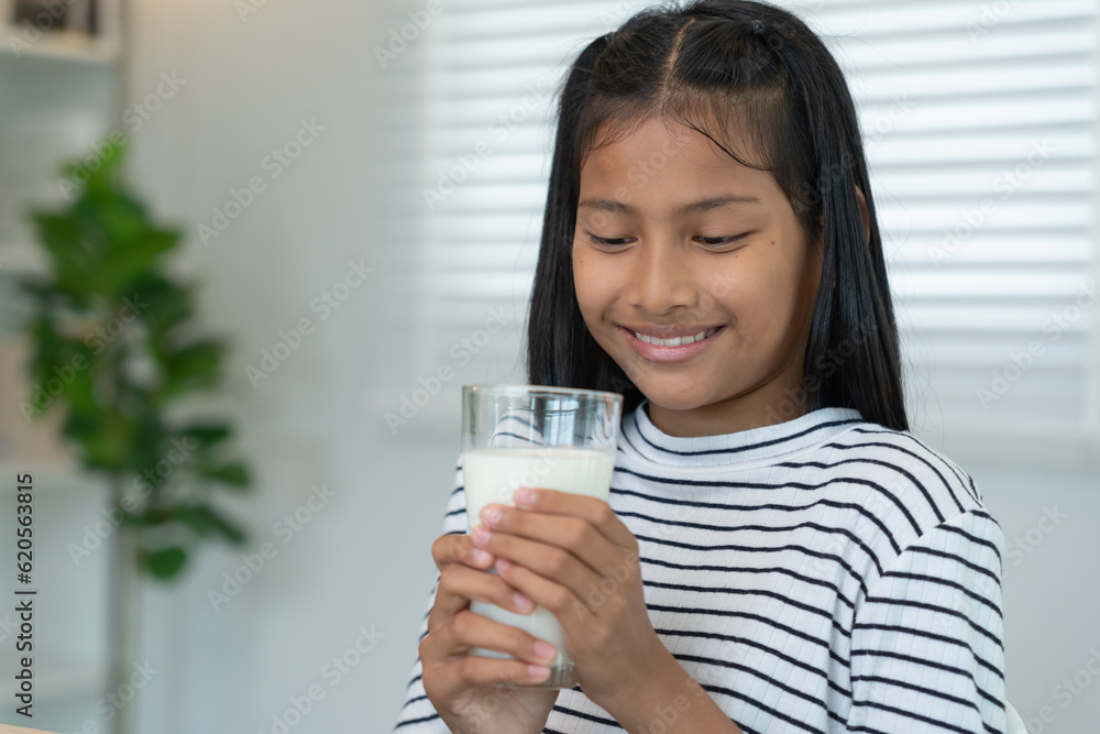 children women drink milk to nourish the body and nourish the brain. asian young little girl learn at home. girl happy drink milk and read a book for exam, Homeschool. education, vitamins children women drink milk to nourish the body and nourish the brain. asian young little girl learn at home. girl happy drink milk and read a book for exam, Homeschool. education, vitamins