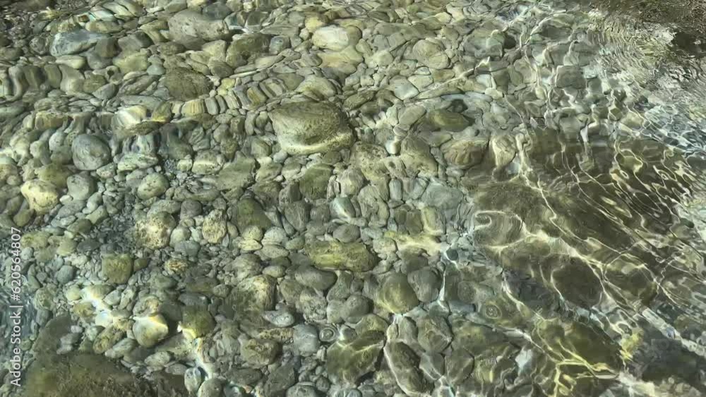 Clear water with pebbles and stones at the bottom of sea. Clear water with pebbles and stones at the bottom of sea.