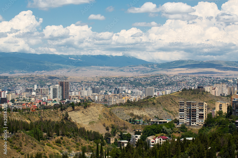 Saburtalo Vake district in Tbilisi, Georgia on a sunny summer day with beautiful clouds.