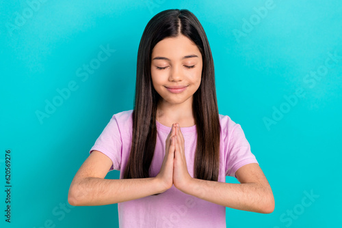Photo of cute little girl palms together closed eyes meditation prayer harmony t Fototapet