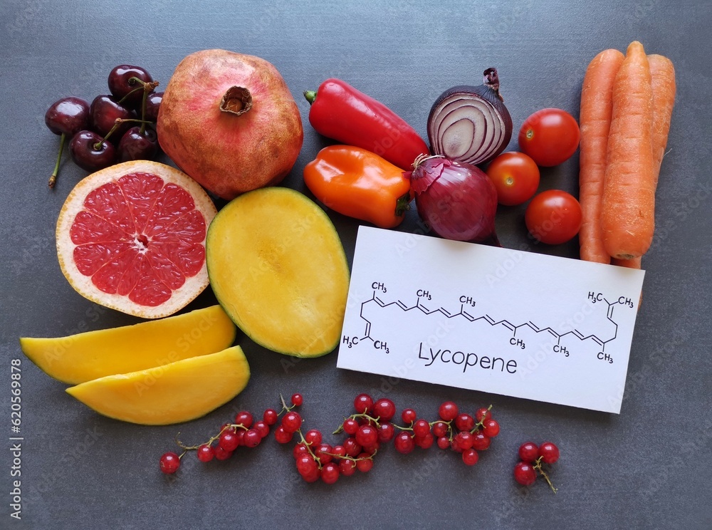 Foods rich in lycopene with structural chemical formula of lycopene molecule. Natural food