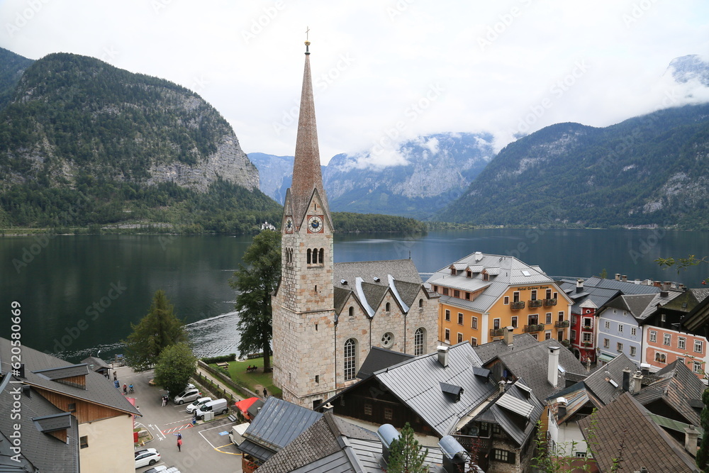 A town nestled by a picturesque lake with breathtaking mountain views, Austria