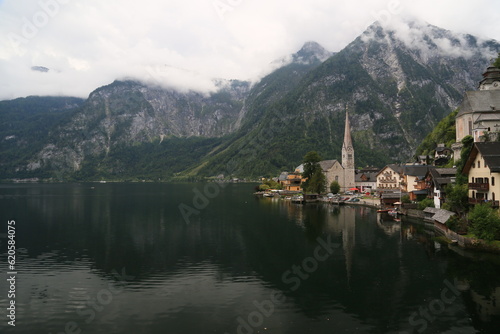 A view of a town with a lake and mountains in the background, Austria