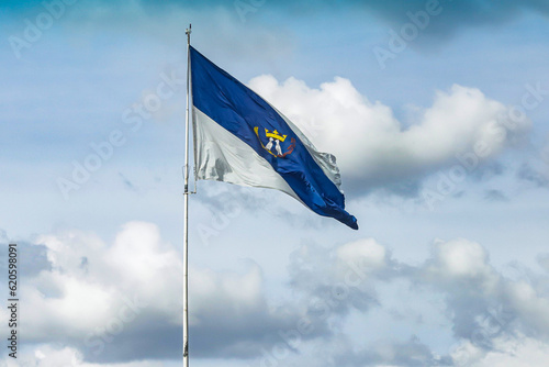 Flag of the city of Ponta Grossa, city of Paraná located in the southern region of Brazil, in a sky with clouds.