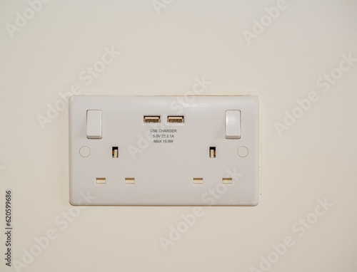 flush white plastic double twin domestic house wall power sockets with integrated USB charing ports combined UK