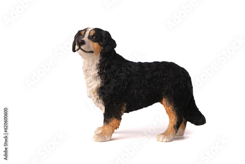 dog figurine toy Bernese Mountain Dog made of wood, isolated on white