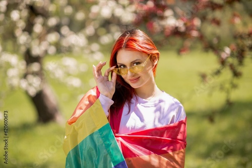 In perfect sunny day closeup to the camera at nature beautiful red hair lady posing in front of the camera she smile cute