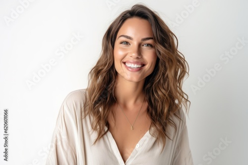 Portrait of a beautiful young woman smiling and looking at camera isolated on a white background photo