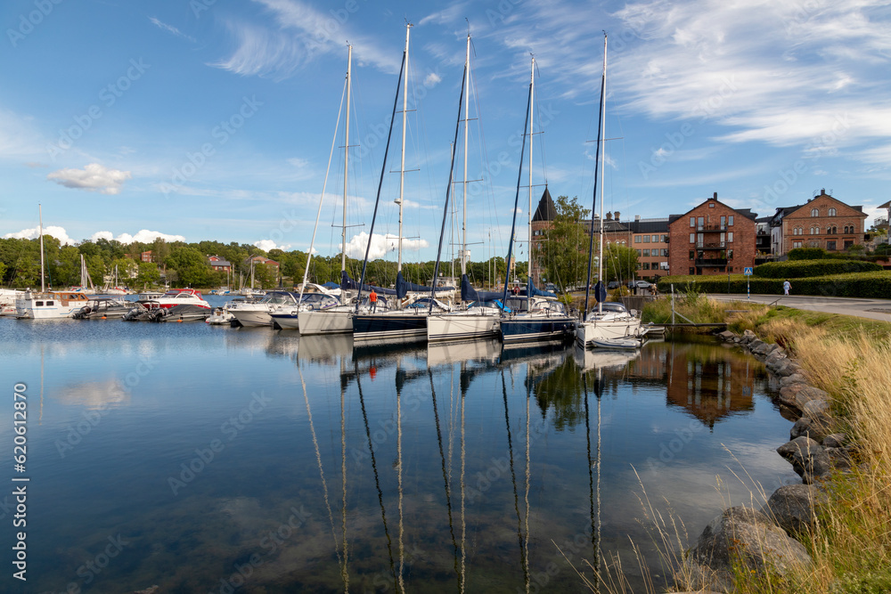 Sweden. Gustavsberg. City embankment with boats and yachts on a summer evening