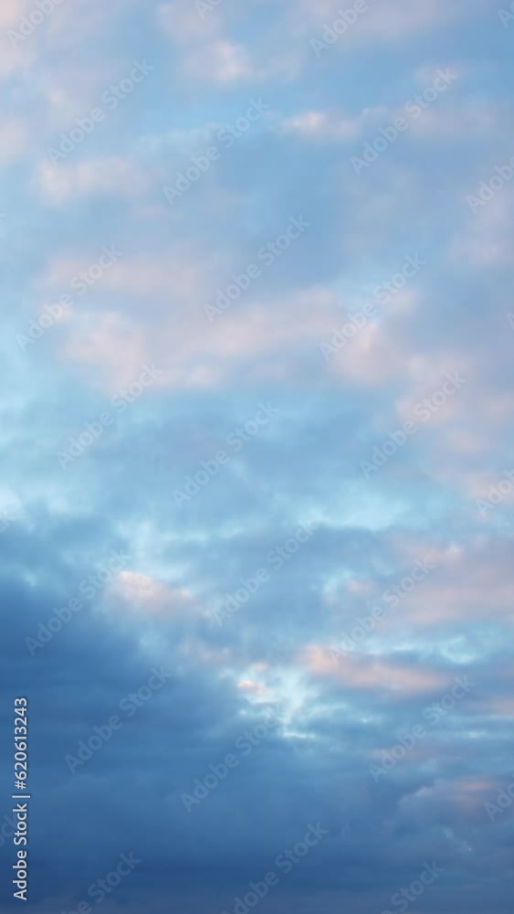 The changing hues of the evening sky are highlighted by the movement of the clouds. The video showcases a stunning timelapse of the sky, with a cloudy backdrop. Vertical format. The changing hues of the evening sky are highlighted by the movement of the clouds. The video showcases a stunning timelapse of the sky, with a cloudy backdrop. Vertical format.