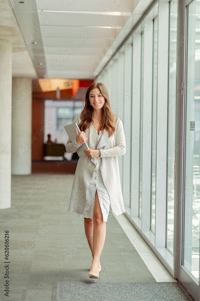 Beautiful smiling confident businesswoman wearing stylish casual clothes working in modern office Beautiful smiling confident businesswoman wearing stylish casual clothes working in modern office