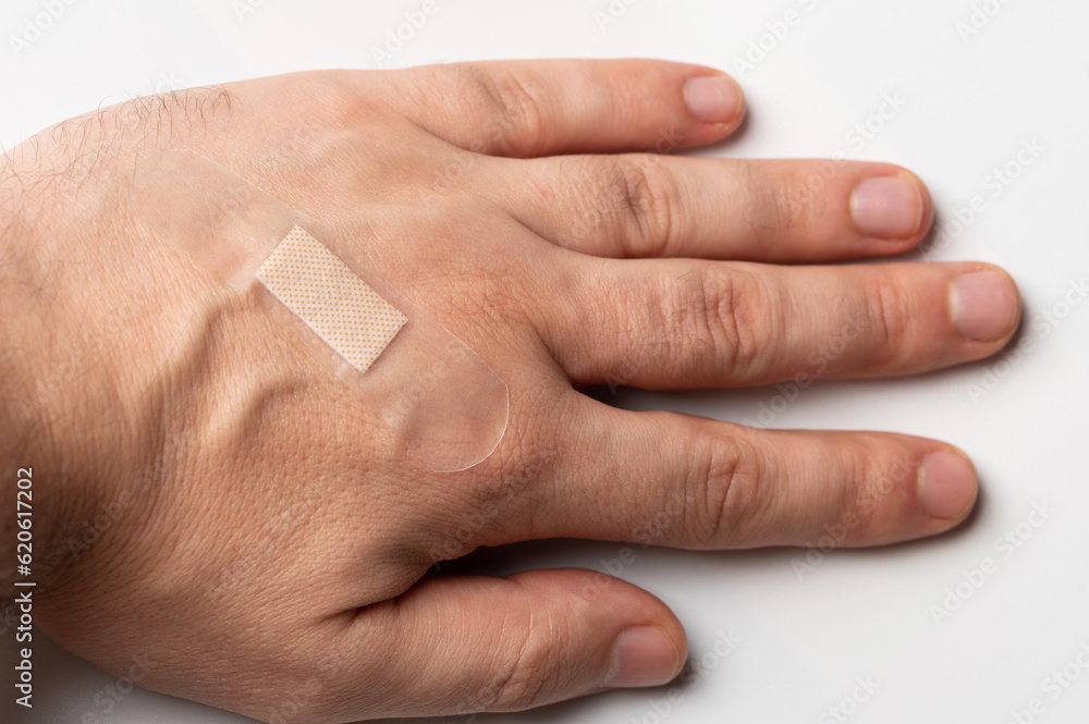 Naklejka premium Sticky plaster on human hand