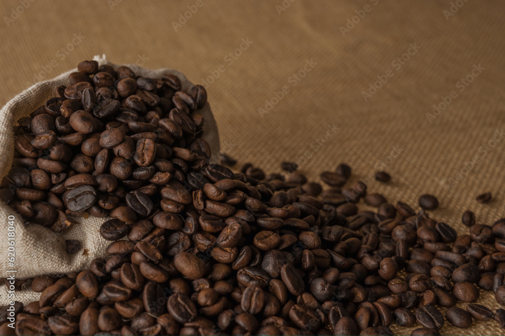 Roasted coffee beans on hemp background. Roasted coffee beans on hemp background.