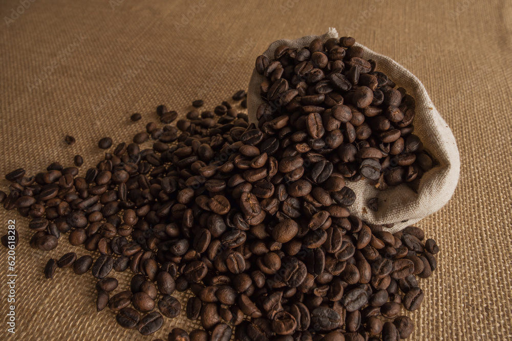 Roasted coffee beans on hemp background. Roasted coffee beans on hemp background.