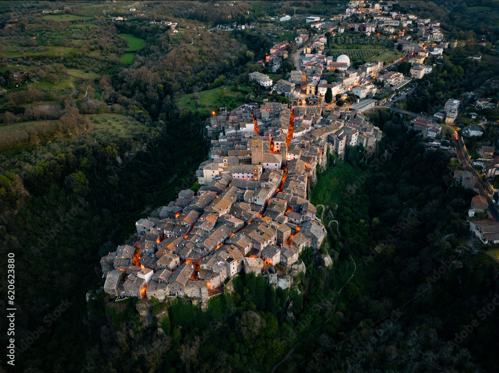 View from above, stunning aerial view of the village of Vitorchiano at sunset. Vitorchiano is a medieval Italian village in Viterbo Province, Lazio, Italy..