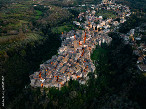 Obraz na płótnie View from above, stunning aerial view of the village of Vitorchiano at sunset. Vitorchiano is a medieval Italian village in Viterbo Province, Lazio, Italy.. w salonie