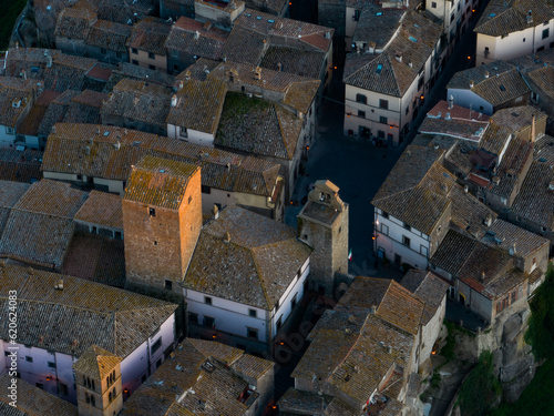Obraz na płótnie View from above, close-up view of the village of Vitorchiano at sunset. Vitorchiano is a medieval Italian village in Viterbo Province, Lazio, Italy.. w salonie
