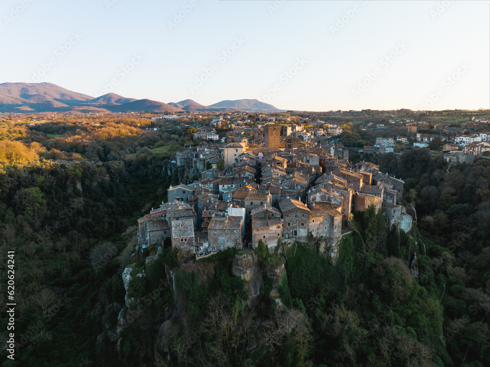 View from above, stunning aerial view of the village of Vitorchiano at sunset. Vitorchiano is a medieval Italian village in Viterbo Province, Lazio, Italy..