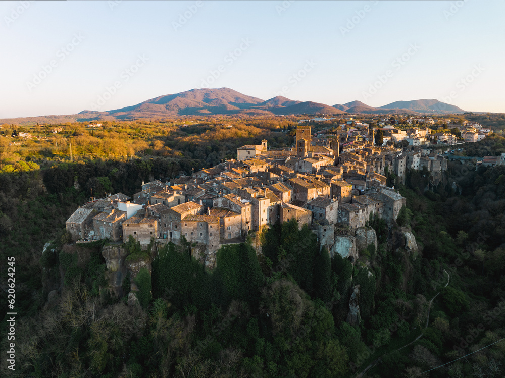 View from above, stunning aerial view of the village of Vitorchiano at sunset. Vitorchiano is a medieval Italian village in Viterbo Province, Lazio, Italy..