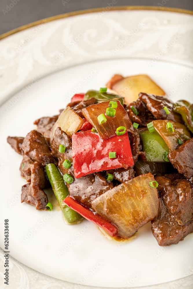 Hot and sour meat sauteed with red pepper, green pepper and onion. Asian cuisine