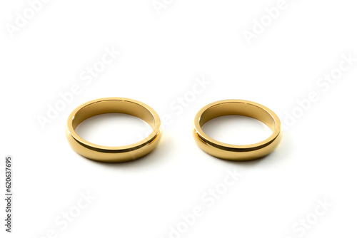 Engagement gold rings side by side on white isolated background