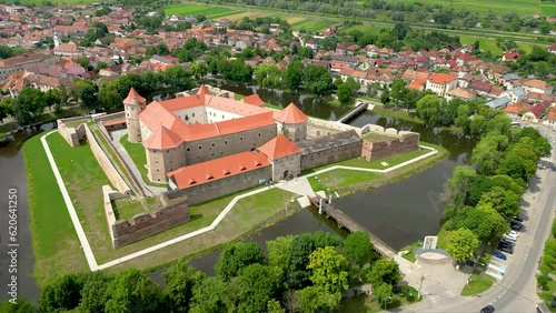 Aerial perspective of Fagaras City. Drone passing above Făgăraș Citadel.  Beautiful panoramic view of all city of Fagaras. The fortress was a prison for political detainees. Today is an museum