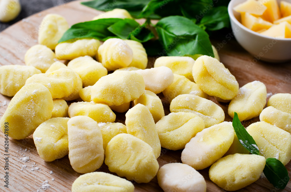 Gnocchi, Fresh Uncooked Potato Gnocchi on Wooden Board, Italian Cuisine Gnocchi, Fresh Uncooked Potato Gnocchi on Wooden Board, Italian Cuisine