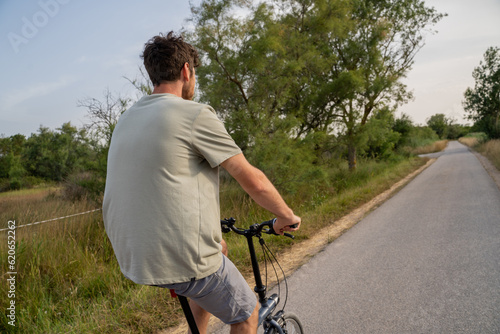 Man going for a bike stroll  in nature photo