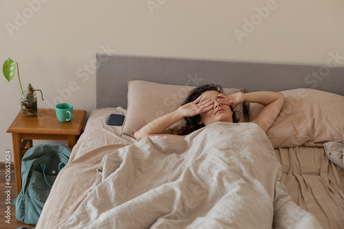 woman rubbing her face