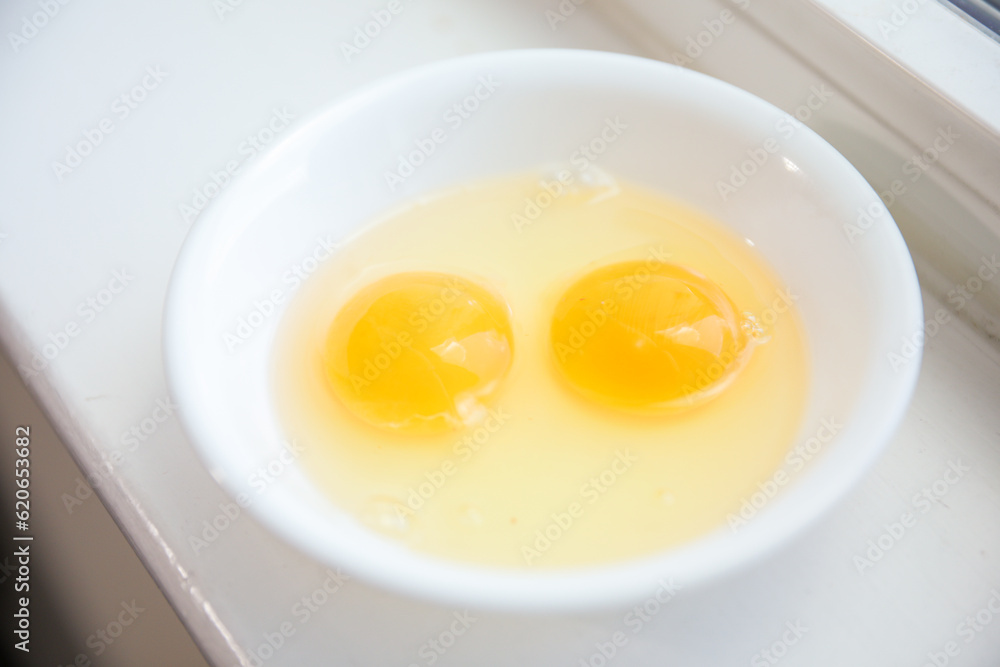 Whole eggs represent vitality and potential, cracked eggs symbolize vulnerability, while yolk represents nourishment. Contextualized against health concerns and rising inflation Whole eggs represent vitality and potential, cracked eggs symbolize vulnerability, while yolk represents nourishment. Contextualized against health concerns and rising inflation