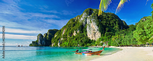 фотография koh phi phi thailand with long tail boat on beach