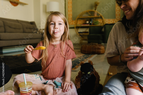Girl with a yogurt on her face