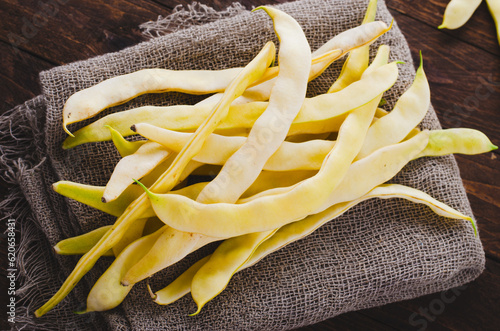 Yellow Wax Beans Ready to Cook, Fresh Long Beans on Wooden Background