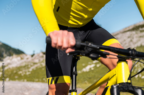 Sporty man riding on mountain bike photo