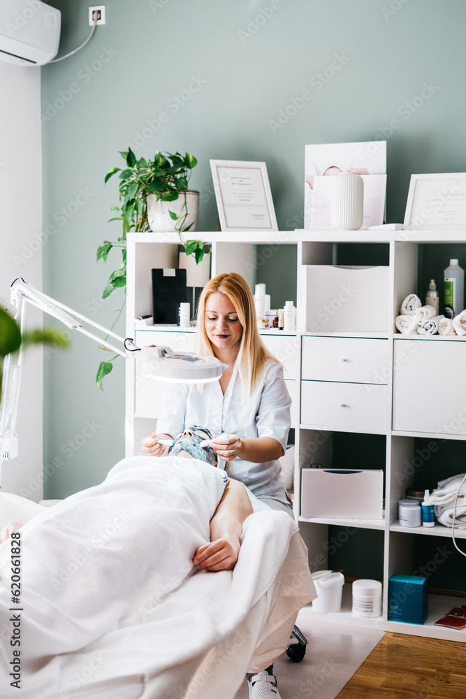 © mak/Stocksy - Beautician at salon © mak/Stocksy - Beautician at salon