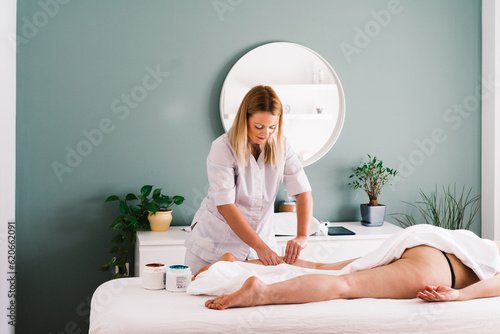 Masseur at work in beauty studio photo