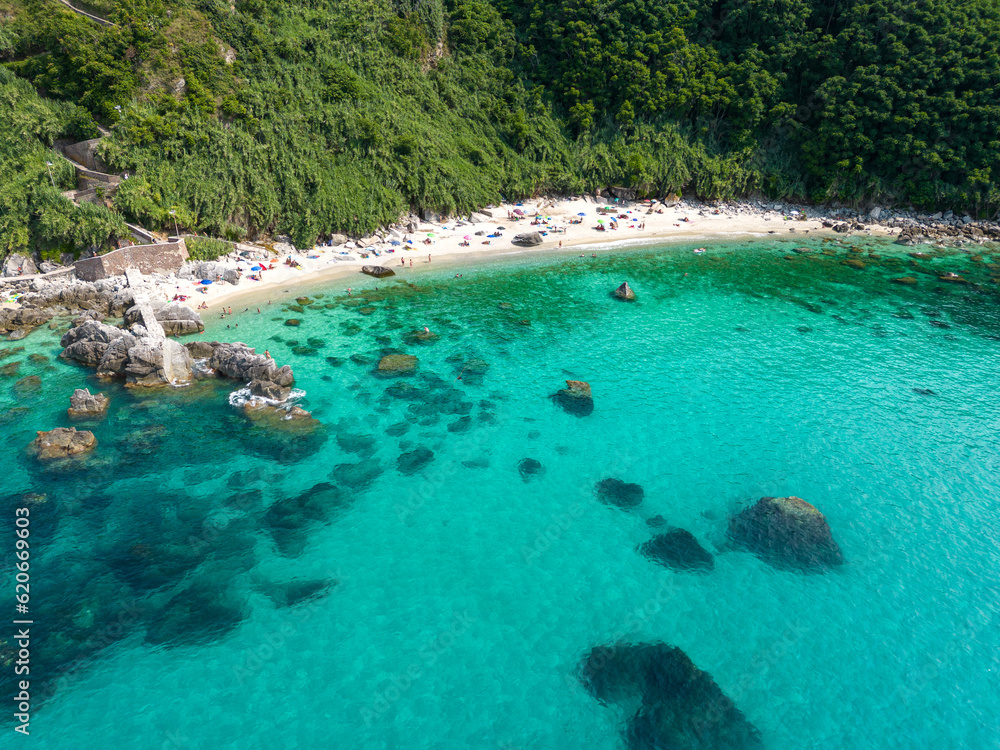 panoramic aerial view of Michelino beach near Tropea in Calabria. The sea is crystal clear and Caribbean with colors ranging from turquoise to emerald green