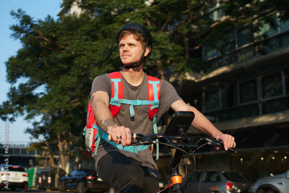 Young Delivery Man On A Bicycle Young Delivery Man On A Bicycle