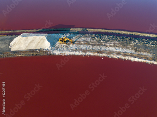 Salt farm excavator top view with salt hill