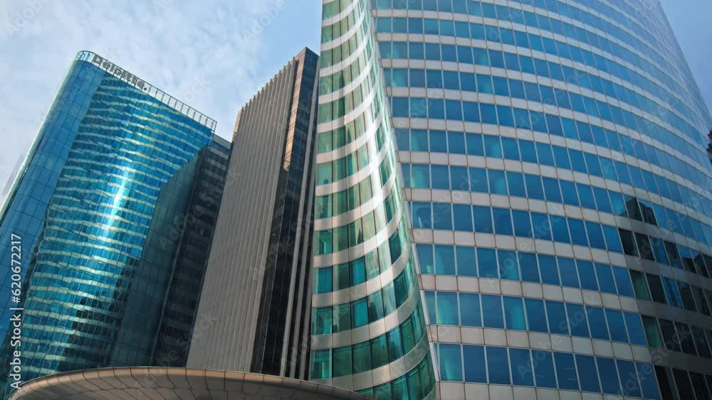 French business center with glass window offices in Paris. Financial district of Paris with futuristic buildings, skyscrapers, corporate architecture, finance banking concept. Cinematic La Defence. French business center with glass window offices in Paris. Financial district of Paris with futuristic buildings, skyscrapers, corporate architecture, finance banking concept. Cinematic La Defence.