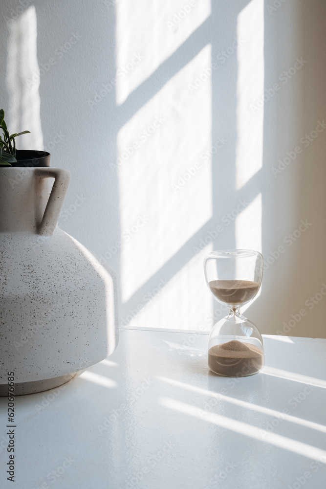 A Sunlit Room with an hourglass A Sunlit Room with an hourglass