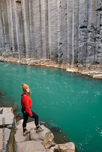 woman admiring Iceland Studlagil valleyon photo