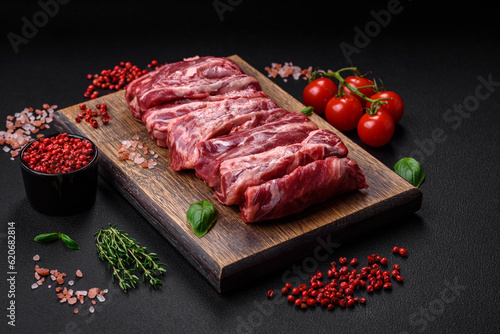 Fresh raw beef ribs with salt, spices and herbs