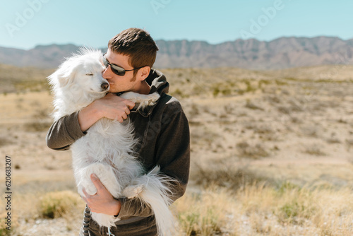 Man loves dog in the desert photo