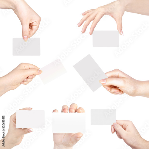 Collection of blank cards in a hand isolated on white © Tanuha