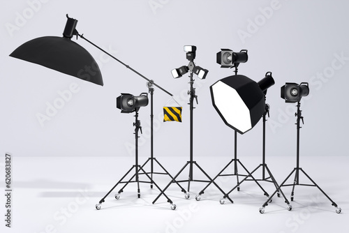 Photography studio flash on a lighting stand on white background photo