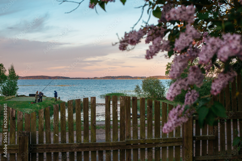 Fototapeta premium Lake with fishermen at dawn